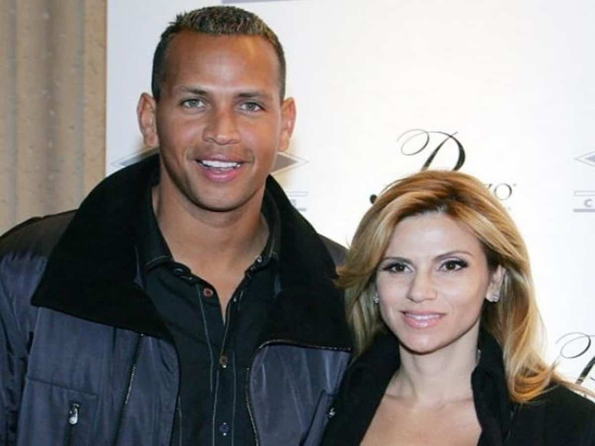 Picture of Alex Rodriguez and Cynthia Scurtis posing for a photo smiling.